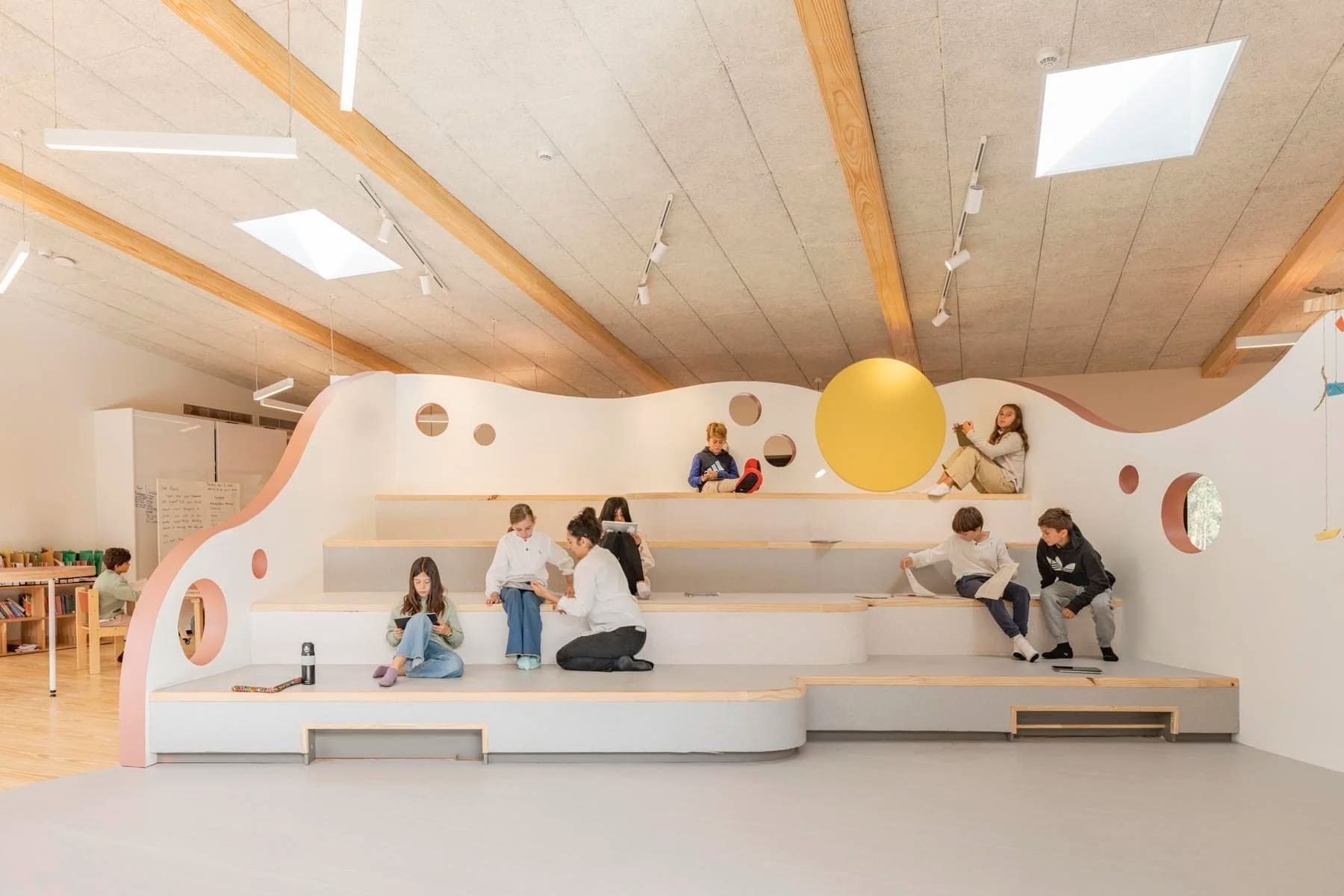 Modern classroom with students learning in creative spaces
