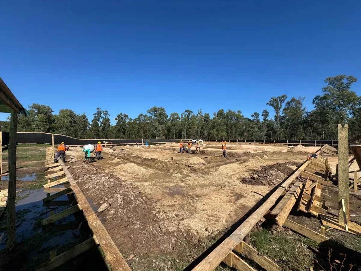 Construction site with workers and formwork
