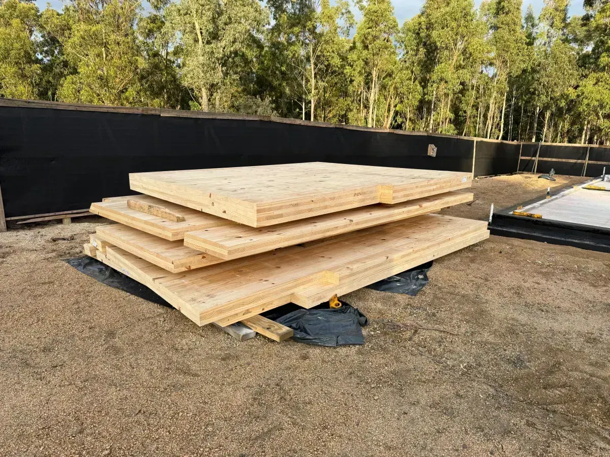 Stacked CLT panels on site