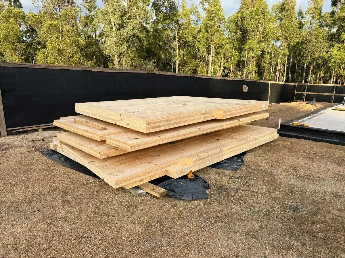 Pile of CLT panels awaiting installation