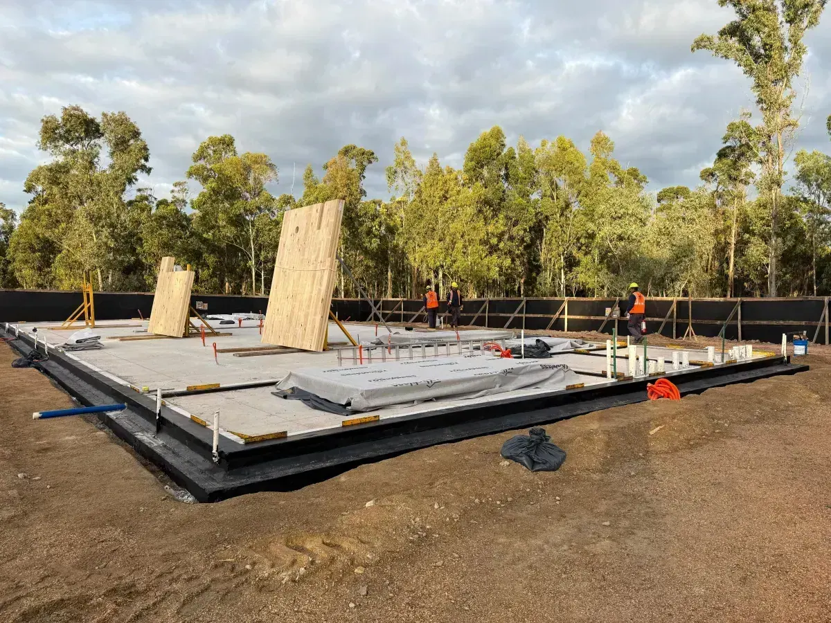 Wide view of site with first wall panel standing