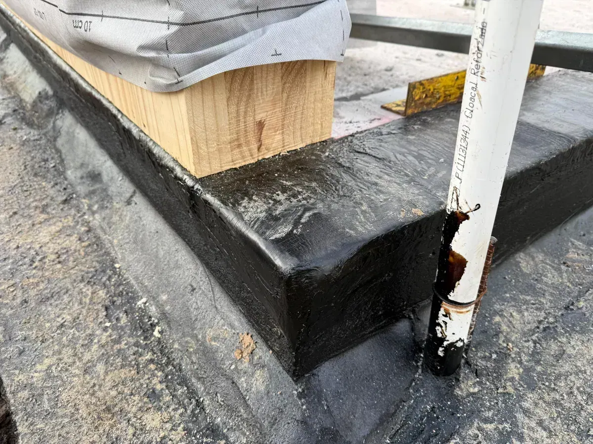 Close-up of waterproofing and timber junction